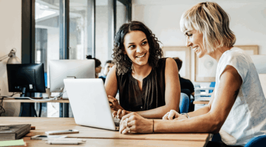 two-women-using-computer