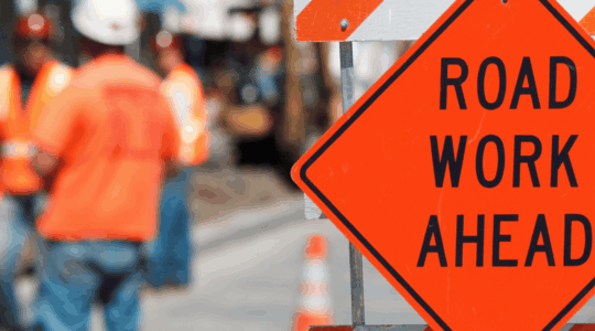 road-work-sign-and-crew