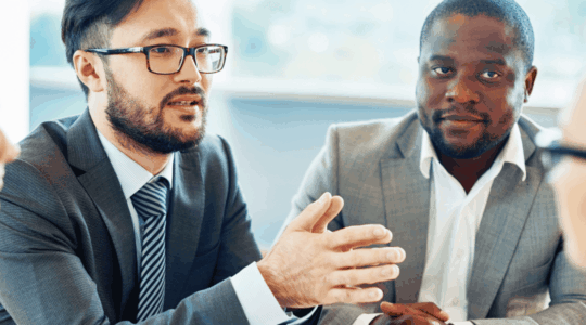 Four-business-people-meeting